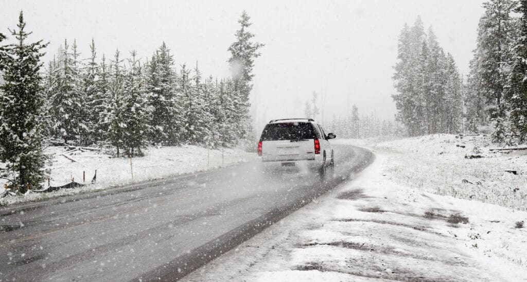 Car driving through the snow