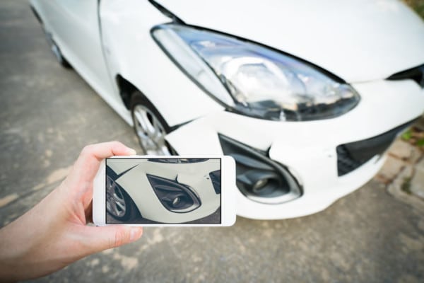 Taking Photo of Wrecked Car | Marietta Wrecker Service