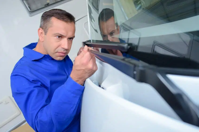 Man Replacing Windshield Wipers | Marietta Wrecker Service