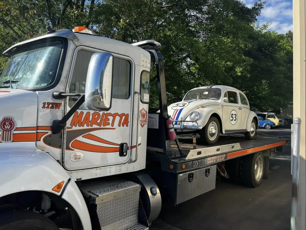 MWS flatbed truck towing beagle car, local towing
