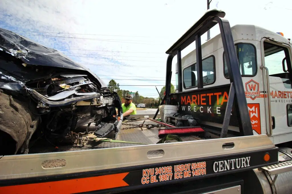 MWS tow truck loading wrecked truck