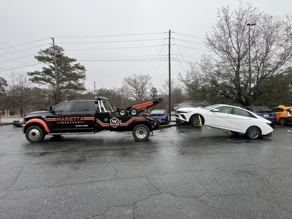 Marietta Wrecker Truck Towing a Vehicle