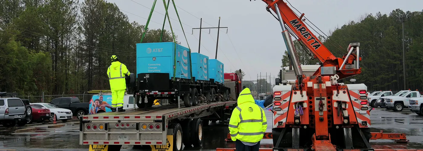 Crane lifting cargo on flatbed | Marietta Wrecker